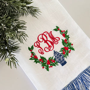 Holly swag embroidery design with a chinoiserie blue and white ginger jar. 