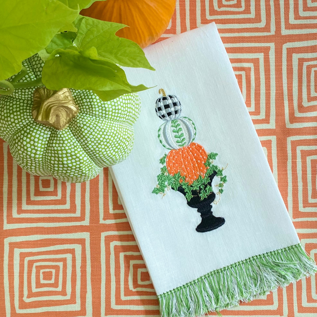 Gingham plaid and polka dots make this pumpkin topiary embroidery design fun for fall. The digital file contains the design in both PES and DST formats. Stacked pumpkin embroidery design